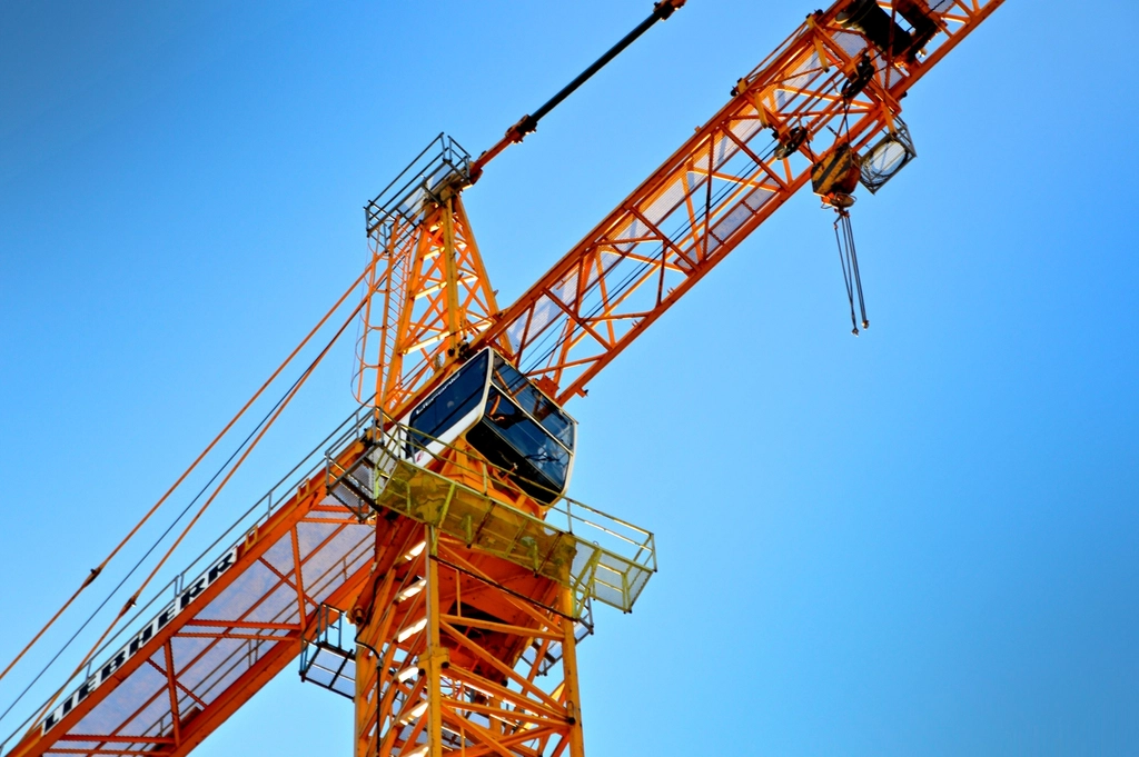 Tower crane against a blue sky